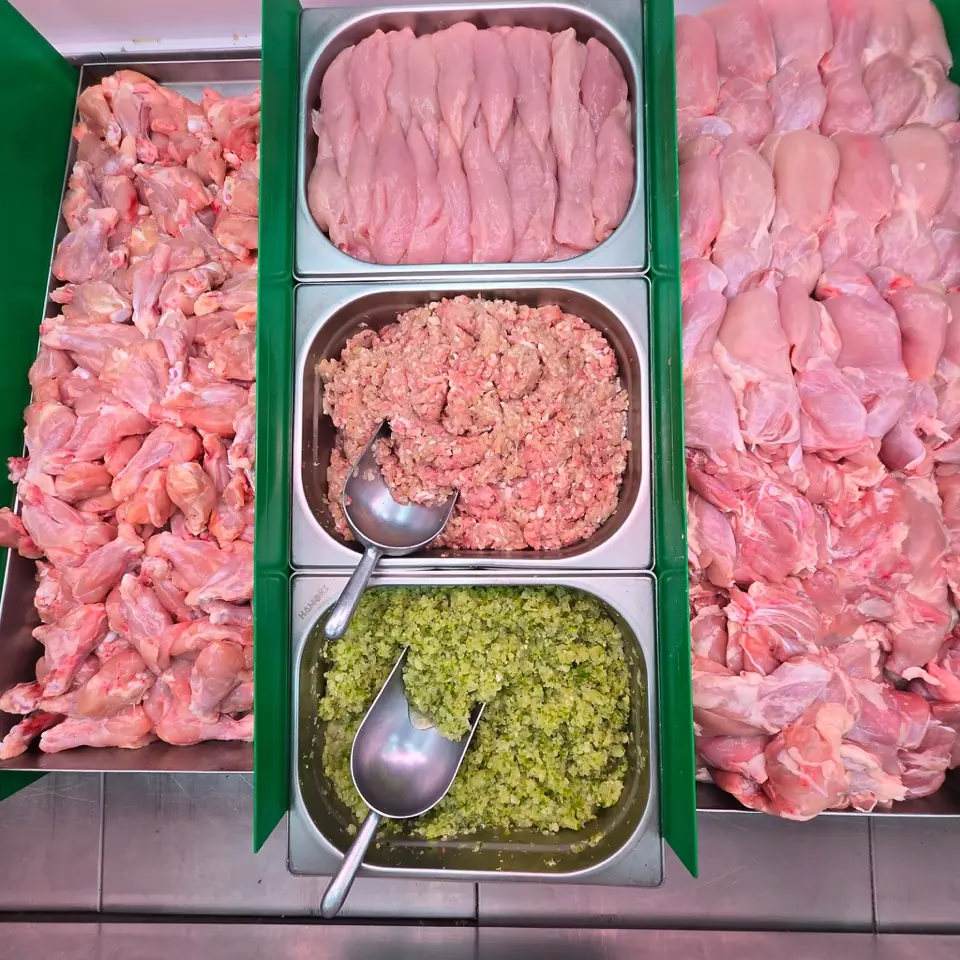 The chicken counter: trays of fresh chicken pieces, fillets and chicken mince